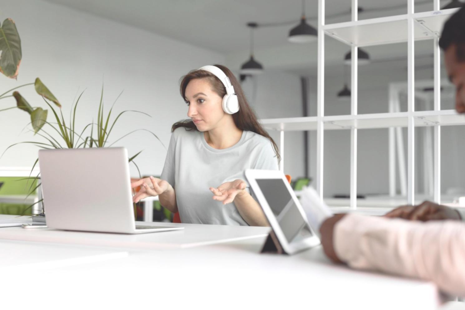 Person reviewing budget spreadsheet on laptop