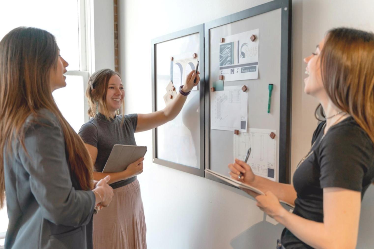 Students reviewing budget planning materials