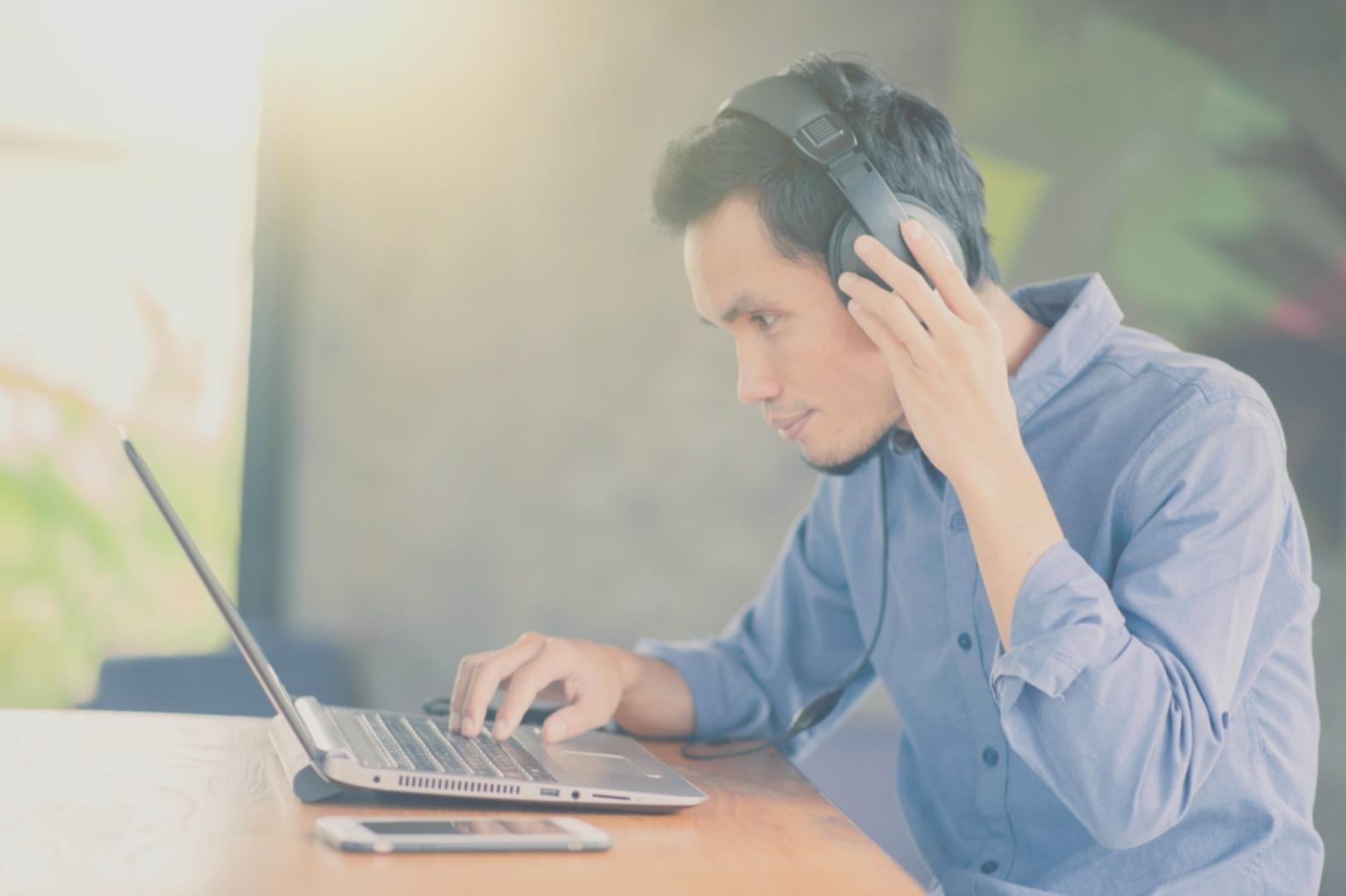 Person reviewing budget spreadsheet with coffee
